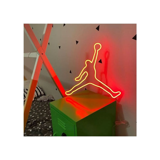 An illuminated neon sign with the symbol of the legendary basketball player's legacy.